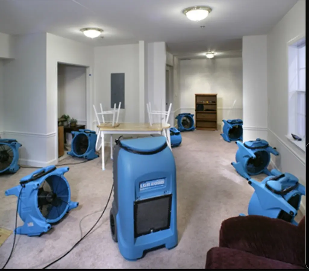 Air movers and dehumidifier setup for Water Damage Restoration in Grain Valley